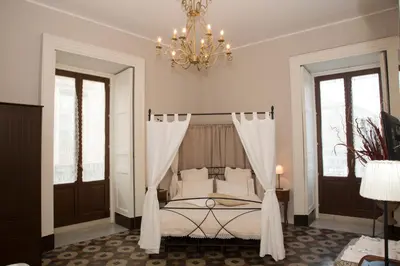 Letto o letti in una camera di B&B Suite Cutelli