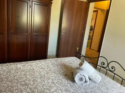 Letto o letti in una camera di Brunello con veranda e piscina condivisa
