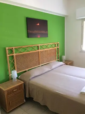 Letto o letti in una camera di Hotel Il Triangolo