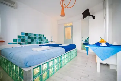 Letto o letti in una camera di Suite House L'Isola Che Non C'è
